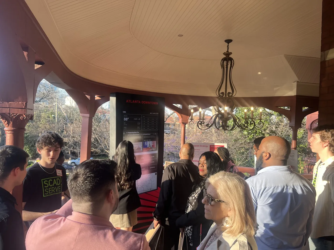 Stakeholders gathered around the kiosk on display