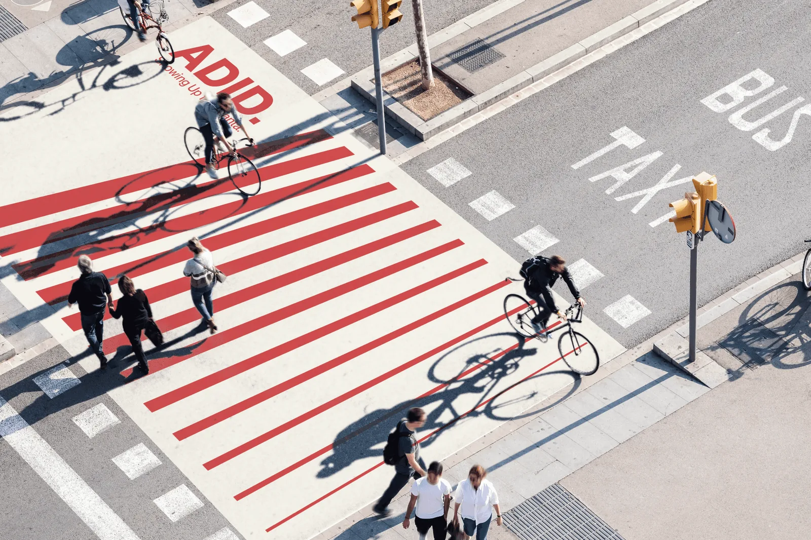 Aerial view of a downtown Atlanta crosswalk painted with ADID’s red stripes